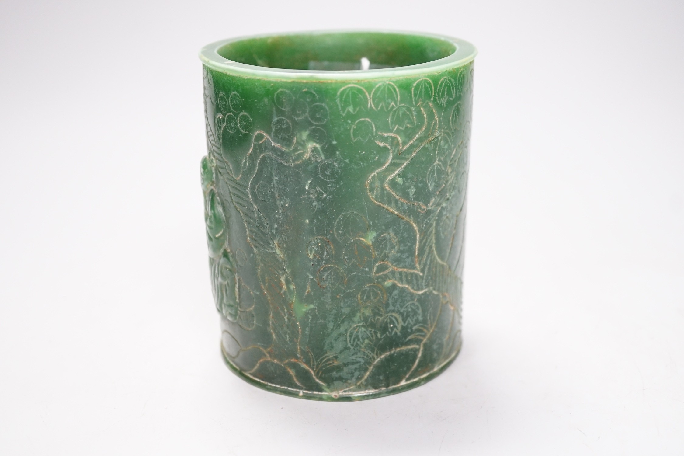 A Chinese incised green glass cylindrical brushpot, 11cm